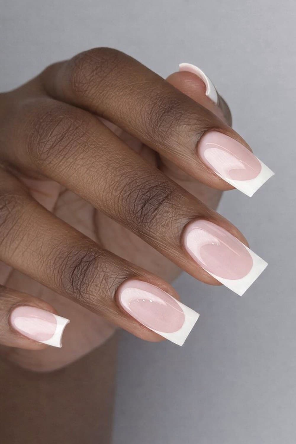Long square French-tip nail extensions